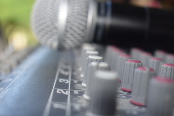 Obraz na płótnie Canvas microphone on the mixer SOUND SYSTEM