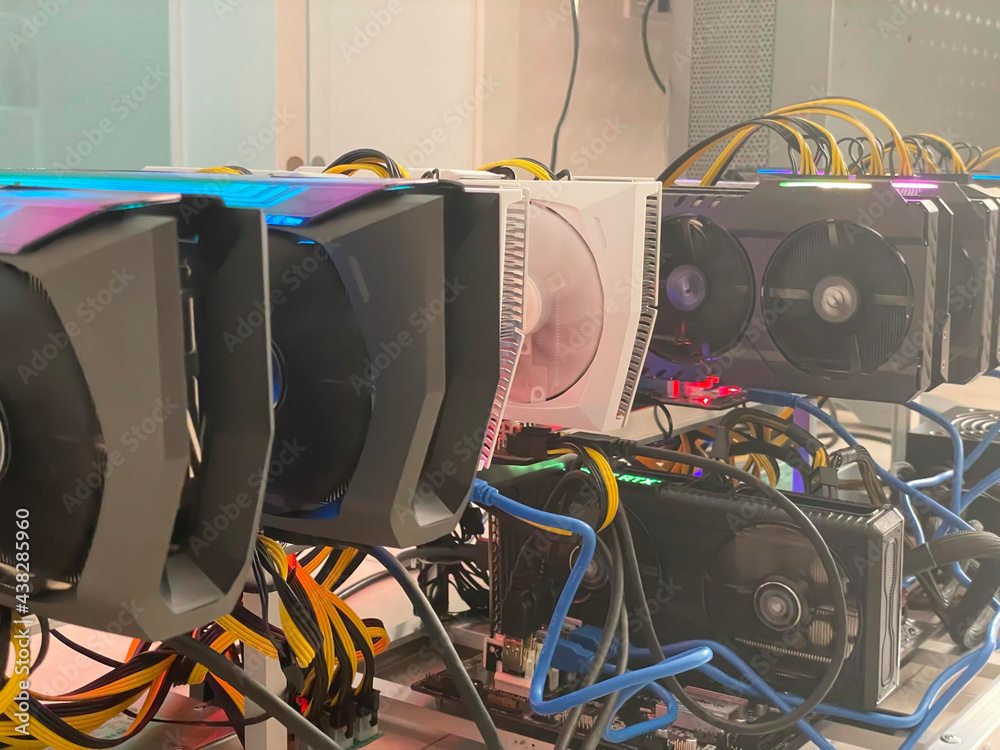 Poster row of bitcoin miners set up on the wired shelfs. device for mining crypto currency. mining cryptocu
