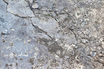 Cracked concrete texture closeup background.