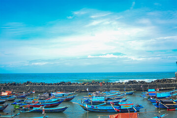 Fototapeta na wymiar Indonesian sea view with fishing boats. Beautiful traditional fishing boats. Traditional people 