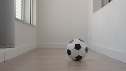 Football ball at home. Balcony training.