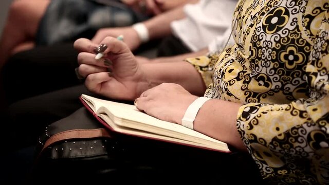 Woman writing in a paper / Woman hands