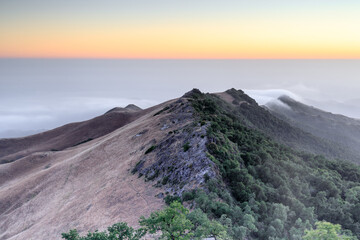 Naklejka premium Foggy sunset over Fremont Peak. Fremont Peak State Park, San Benito and Monterey Counties, California, USA.