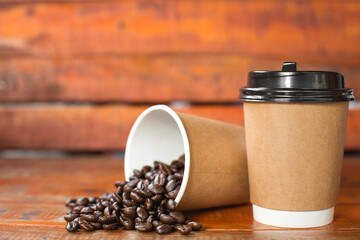 Coffee cup and beans on old kitchen table