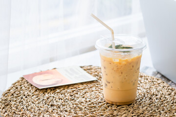 ice latte coffee on table with light in the morning. Refreshing and soft coffee menu for breakfast with copy space for text.