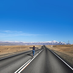 Woman runs away on empty road on country side, view along Chuysky tract, Altai Republic, Russia