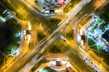 busy road traffic at night time. aerial top view of street road junction in city.