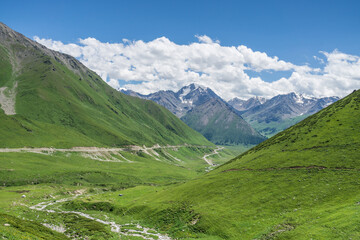 Fototapeta na wymiar Mountains and grasslands along G217 highway in Xinjiang, China in summer