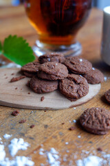 A photo of a pastry and two glasses of a drink on a wooden table