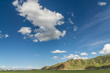 Mountains and grasslands along G217 highway in Xinjiang, China in summer