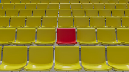 Naklejka premium Red cheering chair among yellow chairs. differences that can coexist. 3D Rendering