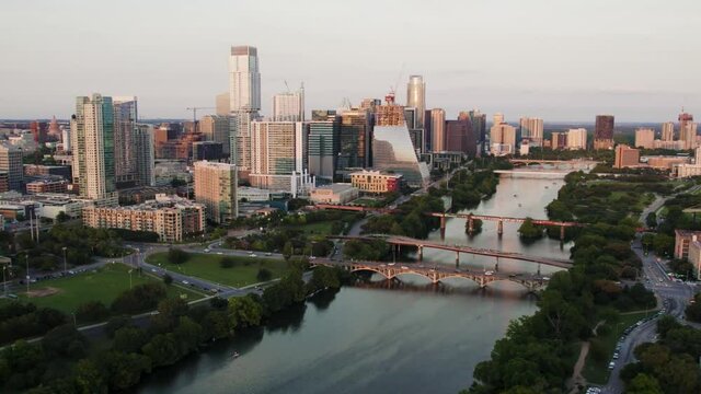 Drone Flyover of Beautiful Downtown Austin, Texas and Ladybird Lake at Sunset in Slow Motion