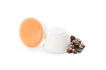 Coffee capsules with beans on white background