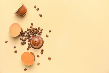 Coffee capsules with beans on color background