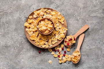 Composition with tasty corn flakes on grey background