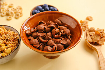 Different cereals on color background, closeup