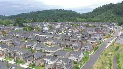 Aerial flying close to newly built houses in a subdivision where typical middle class families live in America.