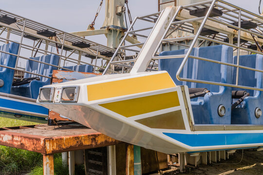 Closeup Of Seats Of Broken Abandoned Carnival Ride