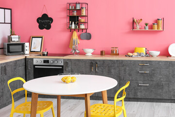 Interior of stylish modern kitchen with dining table
