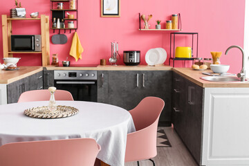 Interior of stylish modern kitchen with dining table