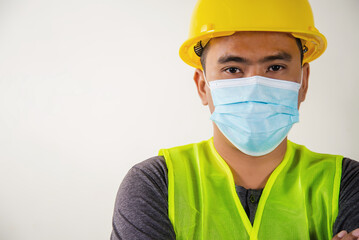Fototapeta na wymiar Young asian worker wearing medical mask