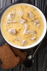 Pea soup Artsoppa Swedish food recipes close up in the plate on the table. Vertical top view from above