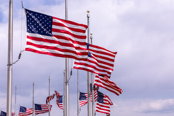 Flags on the United States of America of a flag poles near Washington Monument