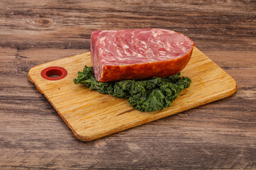 Beef ham piece over board