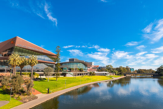 Adelaide, Australia - August 4, 2019: Adelaide Convention Centre viewed across Torrens river from the footbridge on a bright day with blue sky