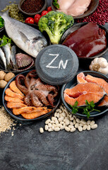 Food high in zinc on dark background. Healthy eating concept.