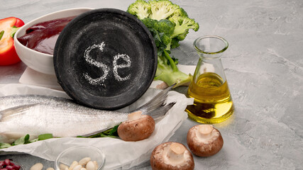 Food high in selenium on light gray background. Healthy eating concept. - obrazy, fototapety, plakaty