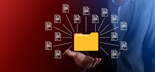 Document Management System DMS .Businessman hold folder and document icon.Software for archiving, searching and managing corporate files and information.Internet Technology Concept.Digital security.