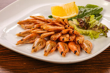Roasted prawn served sliced lemon