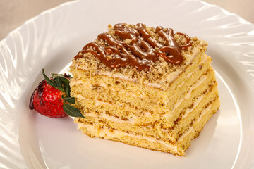 Sweet layered cake served strawberry