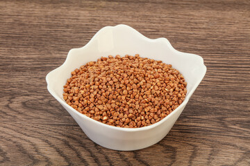 Raw buсkwheat cereal in the bowl