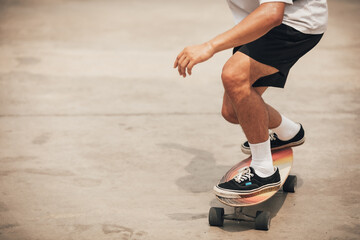 close up of skateboarders foot while skating(vintage tone)