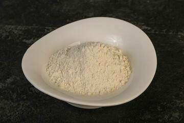 Wheat flour heap in the bowl