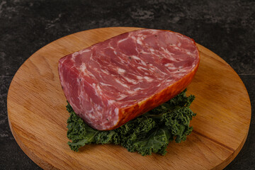 Beef ham piece over board