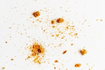 bread crumbs on white background close up selective focus