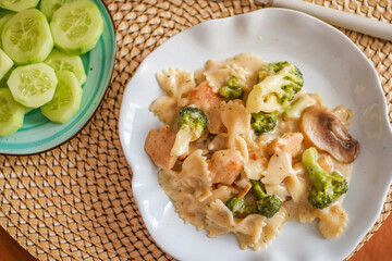 Roasted chicken mushroom pepper pasta in a white plate. toning. selective focus
