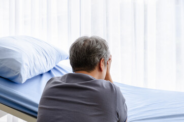 Fototapeta premium Relative of patient grieving on bed in the hospital ward.