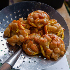 Sausage and nuggets fried with spicy spices on top, strawberry syrup drink