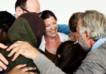 Fototapeta premium Group of diverse people arms around others