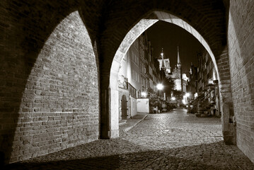 Naklejka premium Old town gate at night