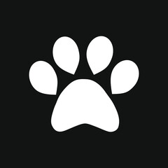 Fototapeta na wymiar Icon of a white paw of a cat on a black background. Vector.