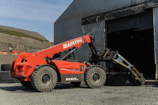 Russia, Polyus (Omchak), June 2, 2021. Manitou loader before installing the tire.