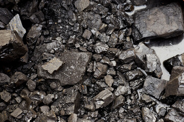 Photos of charcoal, black stones, energy heat