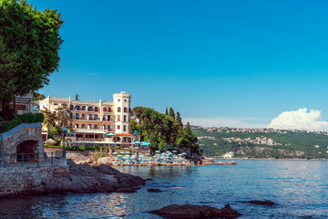 Naklejka premium Beautiful view of waterfront in Opatija with the beach and hotels, Croatia