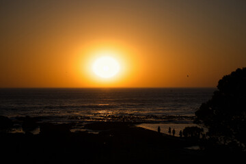 Sunset With People On A Pier