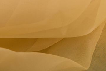 Yellow color tulle fabric texture  with beautiful closeup and elegance detail fabric background